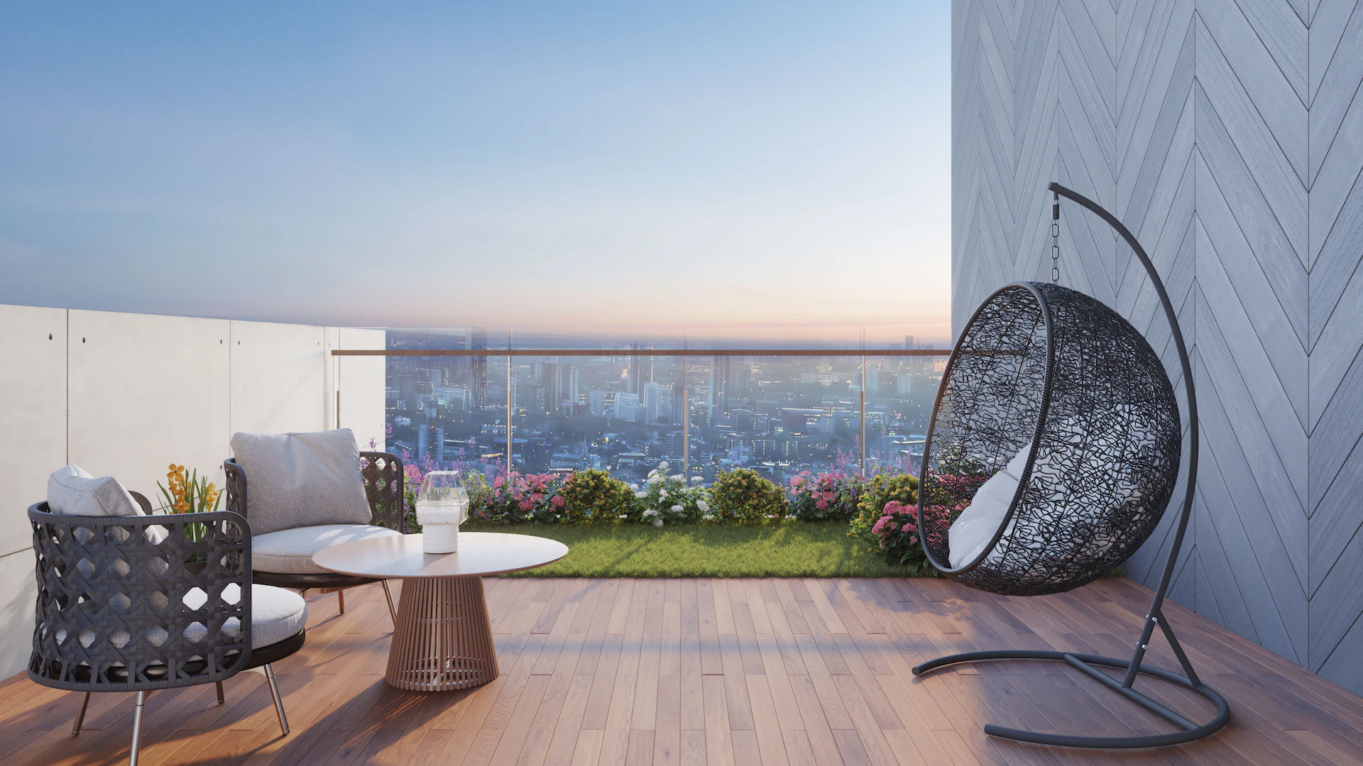 Private rooftop terrace at dusk overlooking the Madrid skyline, with lounge seating and a hanging chair